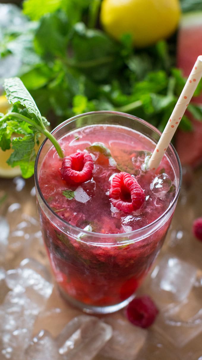 Fruit Mojitos are so easy to make, they are also pretty and refreshing, the perfect summer drink. Raspberry Mojito made with fresh raspberries.