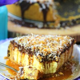 No Bake Coconut Cheesecake is so creamy and indulgent. Topped with chocolate ganache, lots of toasted coconut and finished with caramel sauce.