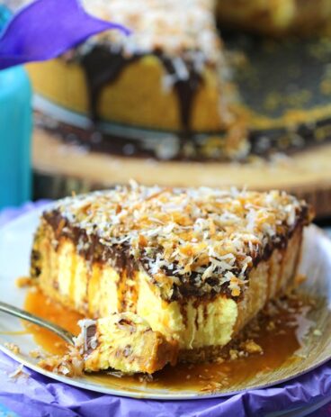 No Bake Coconut Cheesecake is so creamy and indulgent. Topped with chocolate ganache, lots of toasted coconut and finished with caramel sauce.