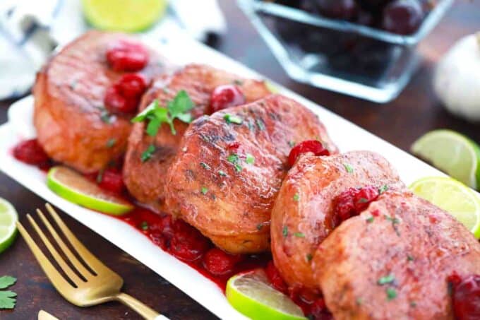 a platter of cherry pork chops