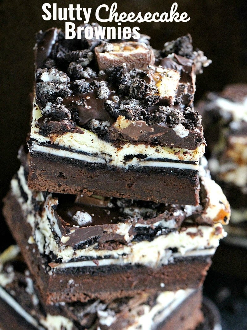 Slutty Cheesecake Brownie Bars made with a layer of fudgy brownie, Oreos, cheesecake, chocolate ganache and chopped Snickers bars. #brownies #chocolate #cheesecake #dessertrecipes #sweetandsavorymeals Slutty Cheesecake Brownie Bars