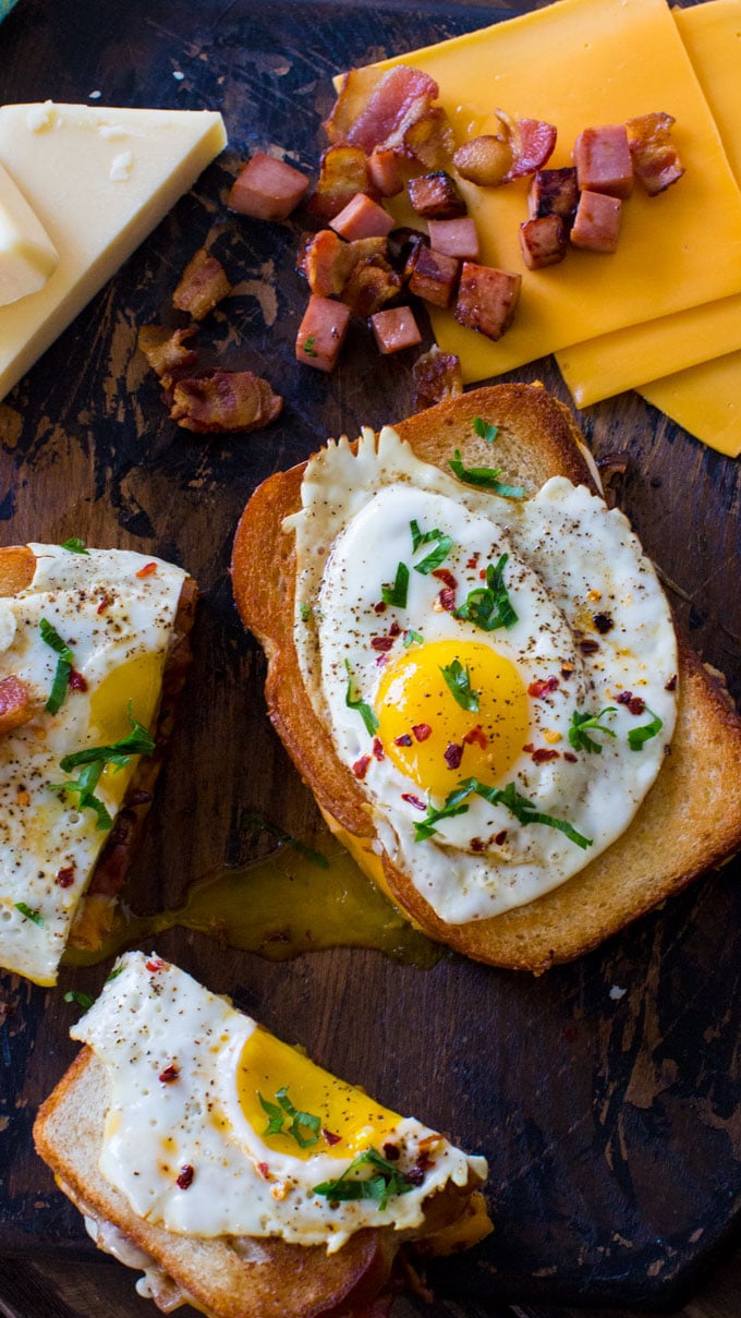 Monte Cristo Grilled Cheese Sandwiches topped with a runny egg