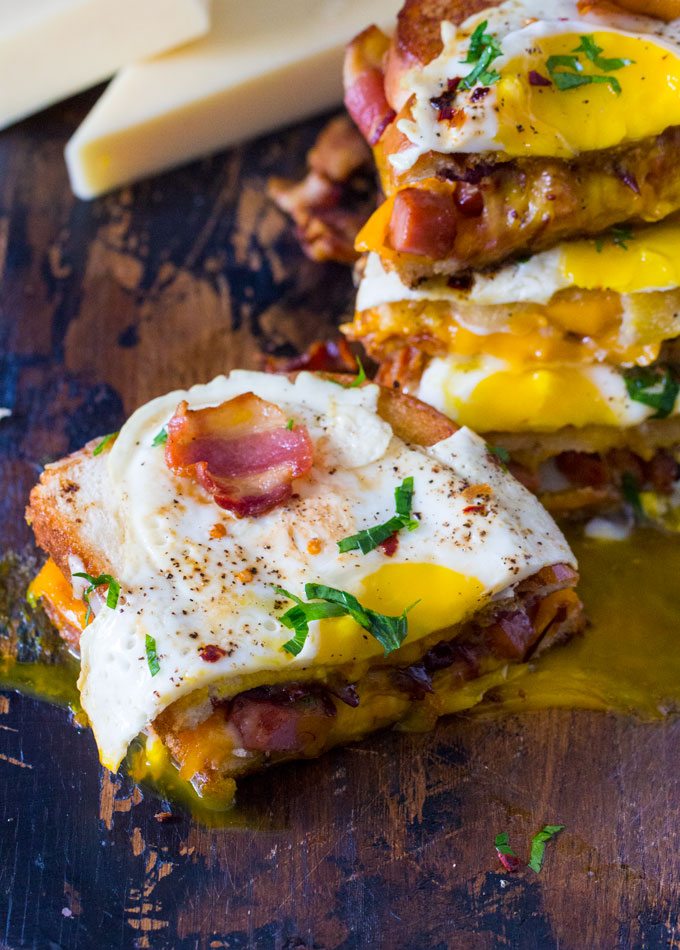  Monte Cristo Grilled Cheese Sandwiches topped with egg and bacon