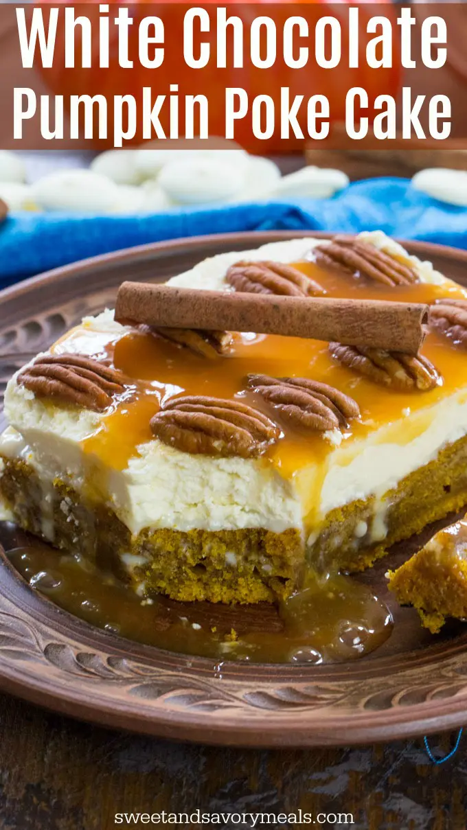 Moist pumpkin poke cake topped with caramel sauce, pecans and cinnamon on a plate.