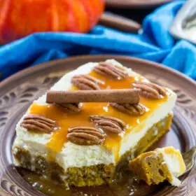 White Chocolate Pumpkin Poke Cake is deliciously infused with a sweet white chocolate sauce, topped with cream cheese frosting, caramel and crunchy pecans.