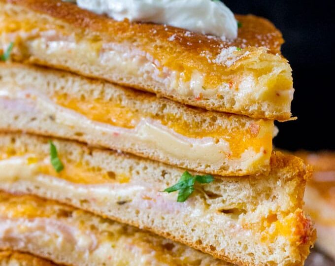 Turkey Grilled Cheese made easy to cook in a large batch using crescent dough sheets. Delicious and fit to feed a crowd with minimum effort!