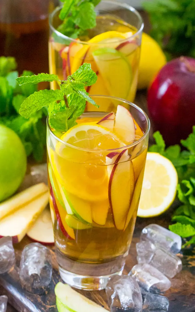 Boozy Apple Iced Tea is the best way to combine a little booze with you favorite fall flavors. Bright and refreshing, this is the perfect fall cocktail.