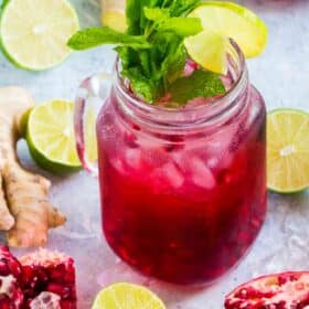 Pomegranate Mojito made with fresh ginger is the perfect fall drink. With a gorgeous color and a sweet, refreshing taste, this will become your go to drink.