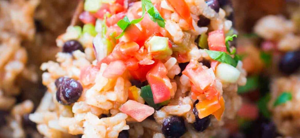 Easy Slow Cooker Rice and Beans is the perfect side dish or vegetarian meal you can make in the slow cooker with just a few ingredients.