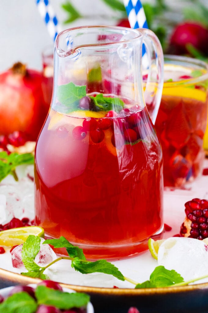 A pitcher of cranberry mocktail.