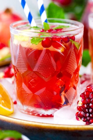 Cranberry mocktail with lemon and pomegranate.