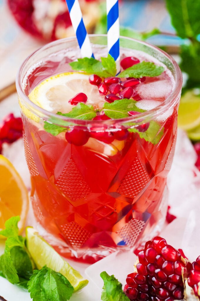 Cranberry mocktail with lemon, mint, and pomegranate.