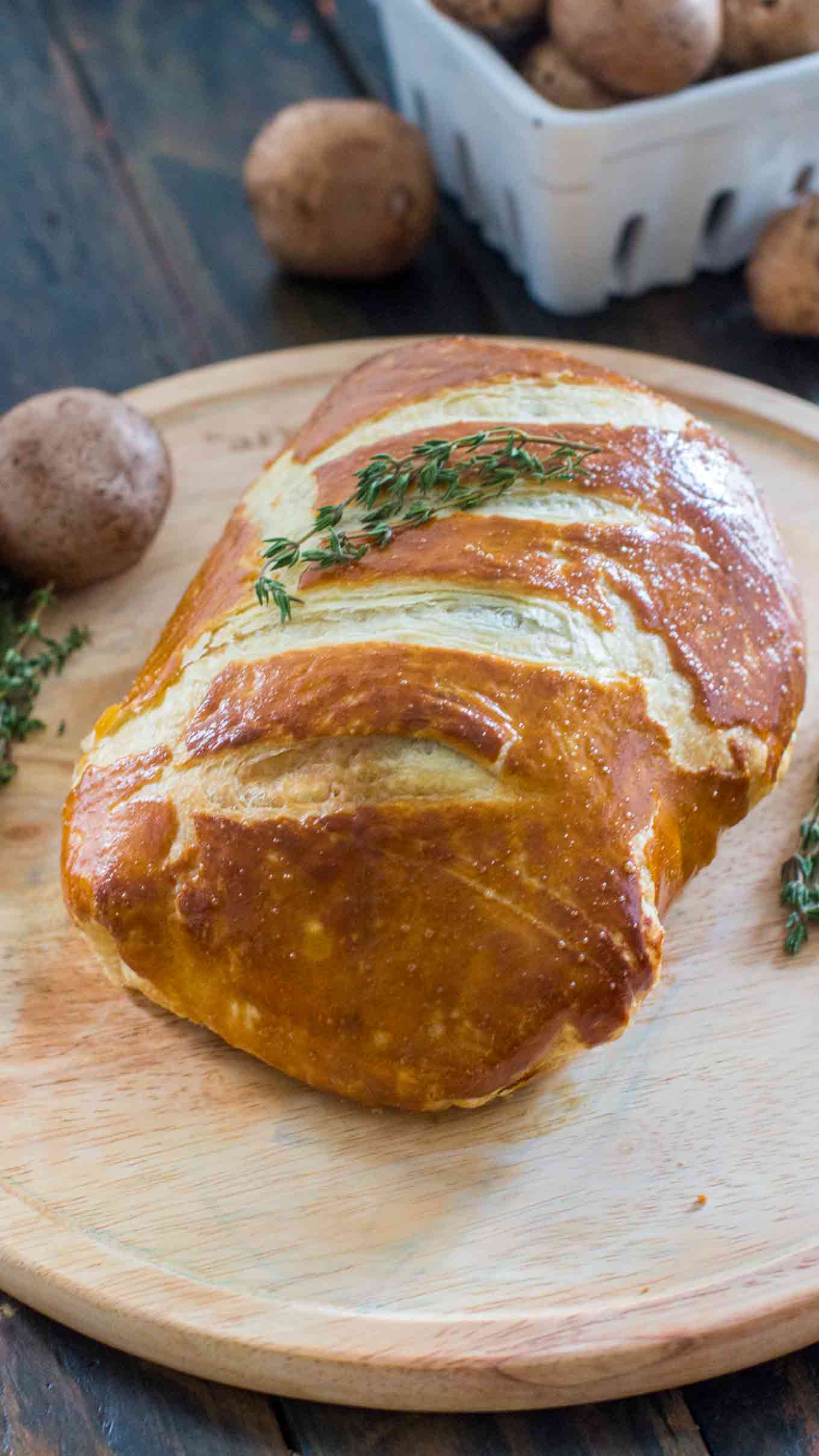 Beef Wellington cooked perfectly while wrapped in puff pastry, ham and the most amazing mushroom duxelles made with cognac duck liver mousse pate.