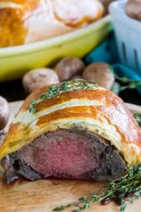 Beef Wellington cooked perfectly while wrapped in puff pastry, ham and the most amazing mushroom duxelles made with cognac duck mousse.
