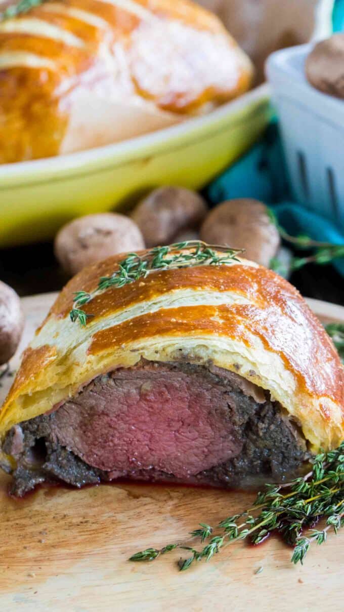 Beef Wellington cooked perfectly while wrapped in puff pastry, ham and the most amazing mushroom duxelles made with cognac duck mousse.