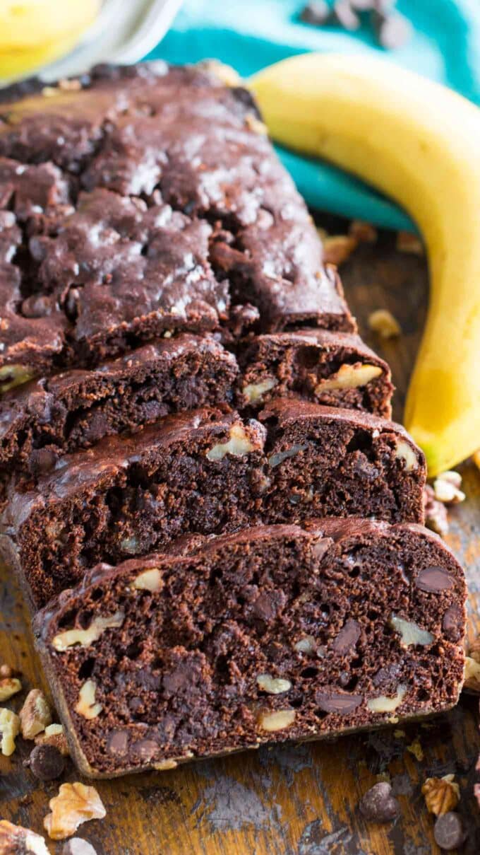 sliced chocolate banana bread on a wooden board