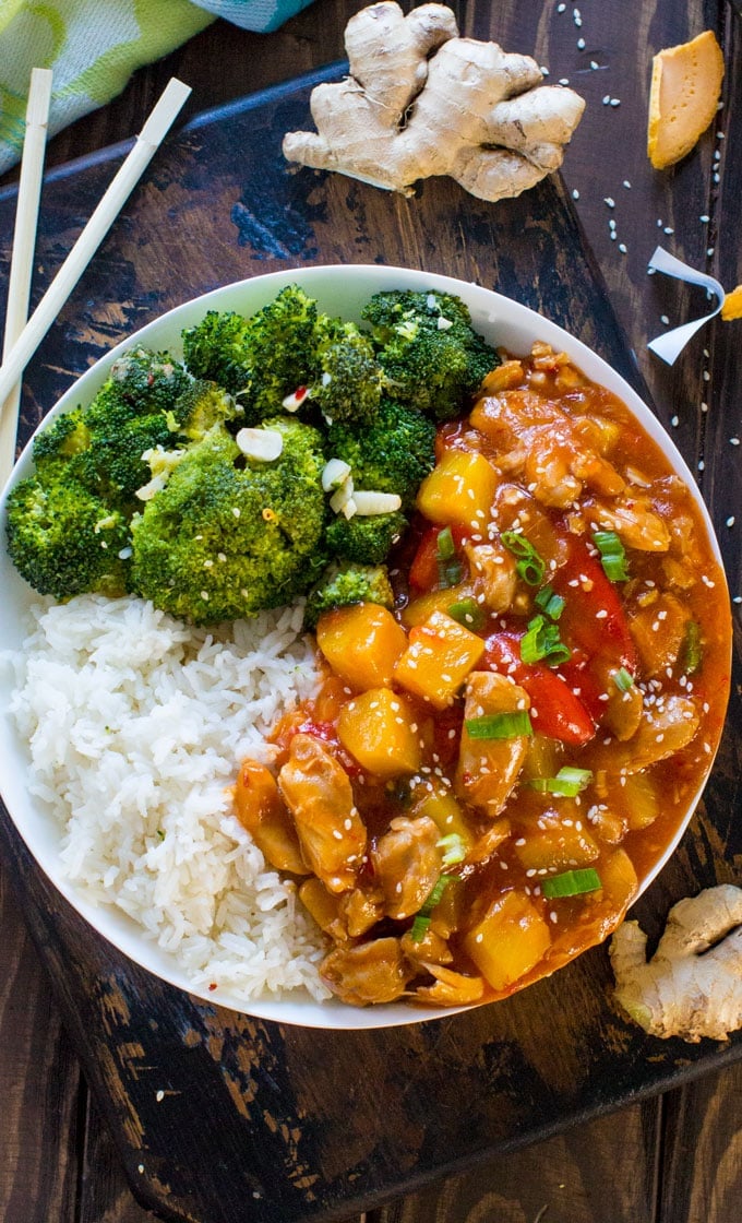 Image pot sweet and sour chicken with white rice and broccoli.