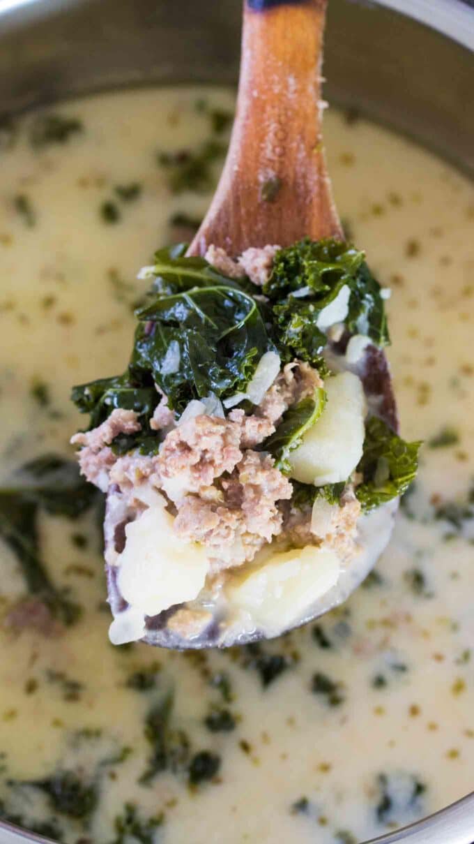 a spoonful of instant pot zuppa toscana with kale and sausage