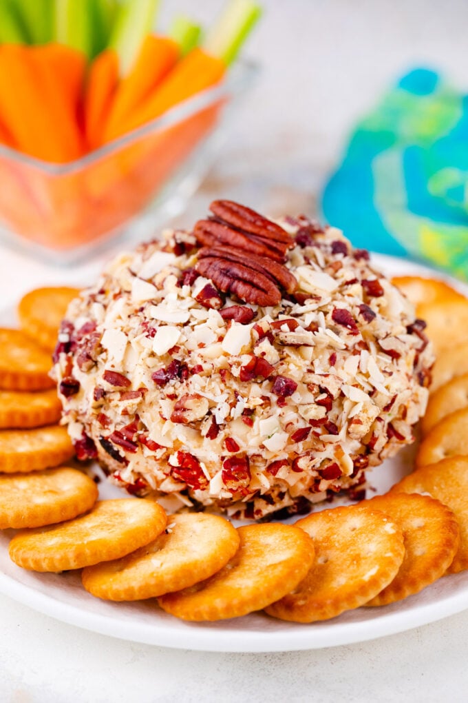 Bacon and cheese cheese ball covered with nuts.