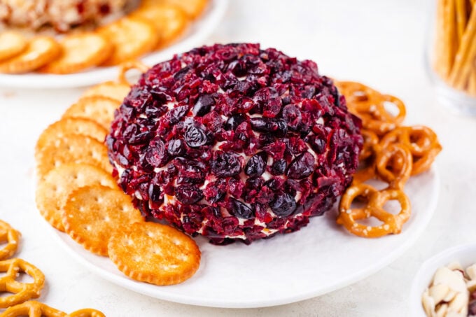 Cranberry bacon and cheese cheese ball served with crackers.