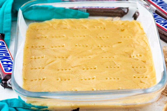 Shortbread layer for Snickers cookie bars.