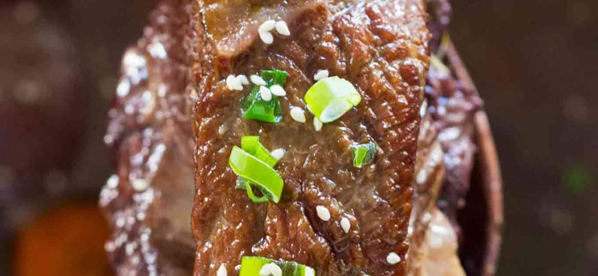 Instant Pot Short Ribs are juicy and fall of the bone, cooked in the most amazing garlic and wine sauce, and ready to eat in just 2 hours!