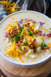 Creamiest Slow Cooker Baked Potato Soup is comforting, budget friendly and also very easy to make! Perfect for a weeknight meal.