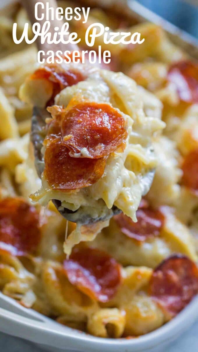 holding a spoon with homemade white pizza casserole