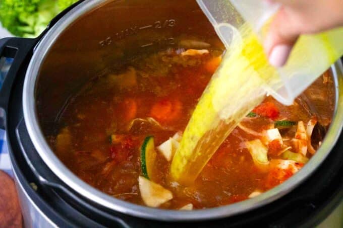 adding broth to instant pot veggie soup