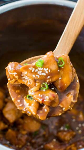 Instant Pot Garlic Sesame Chicken on a serving spoon