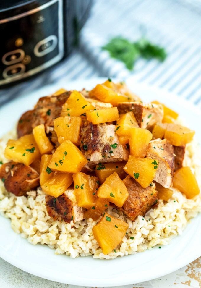 chopped slow cooker pineapple pork loin on top of rice