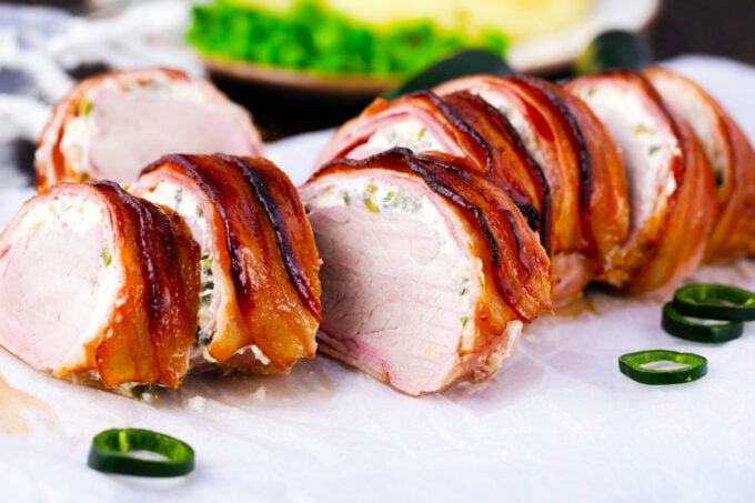 Slices of bacon wrapped pork tenderloin with cream cheese.