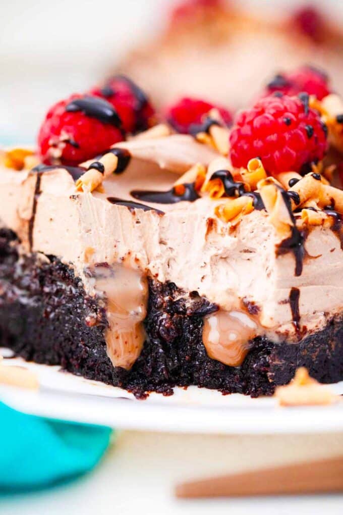 chocolate sauce oozing from a chocolate baileys poke cake