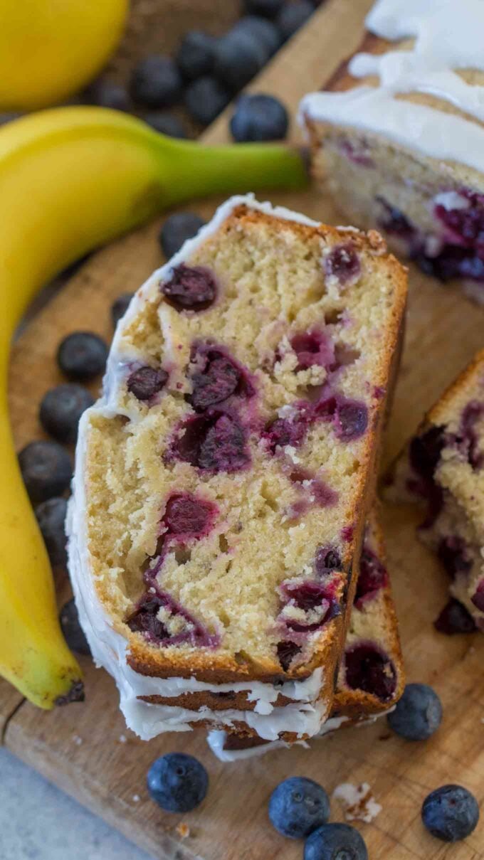 sliced moist blueberry banana bread with lots of blueberries