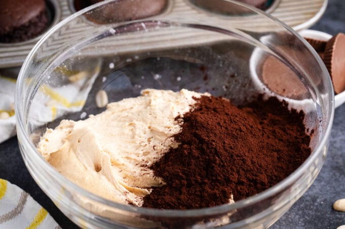 Adding cocoa powder to peanut butter frosting.