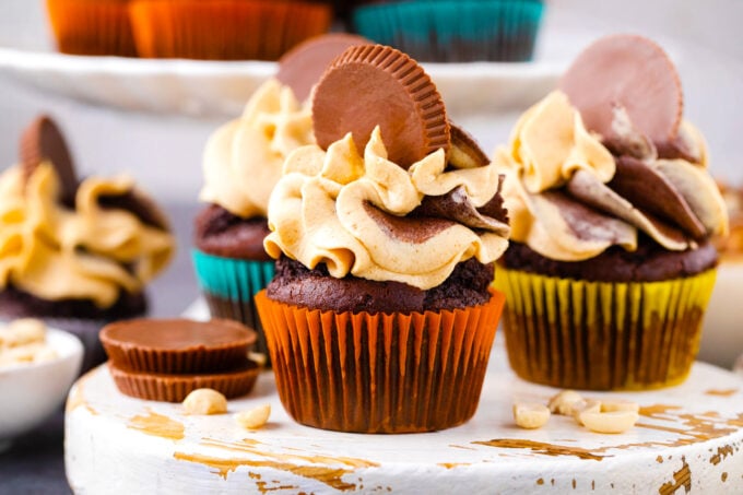 Dark chocolate peanut butter cupcakes topped with Reese's cups.