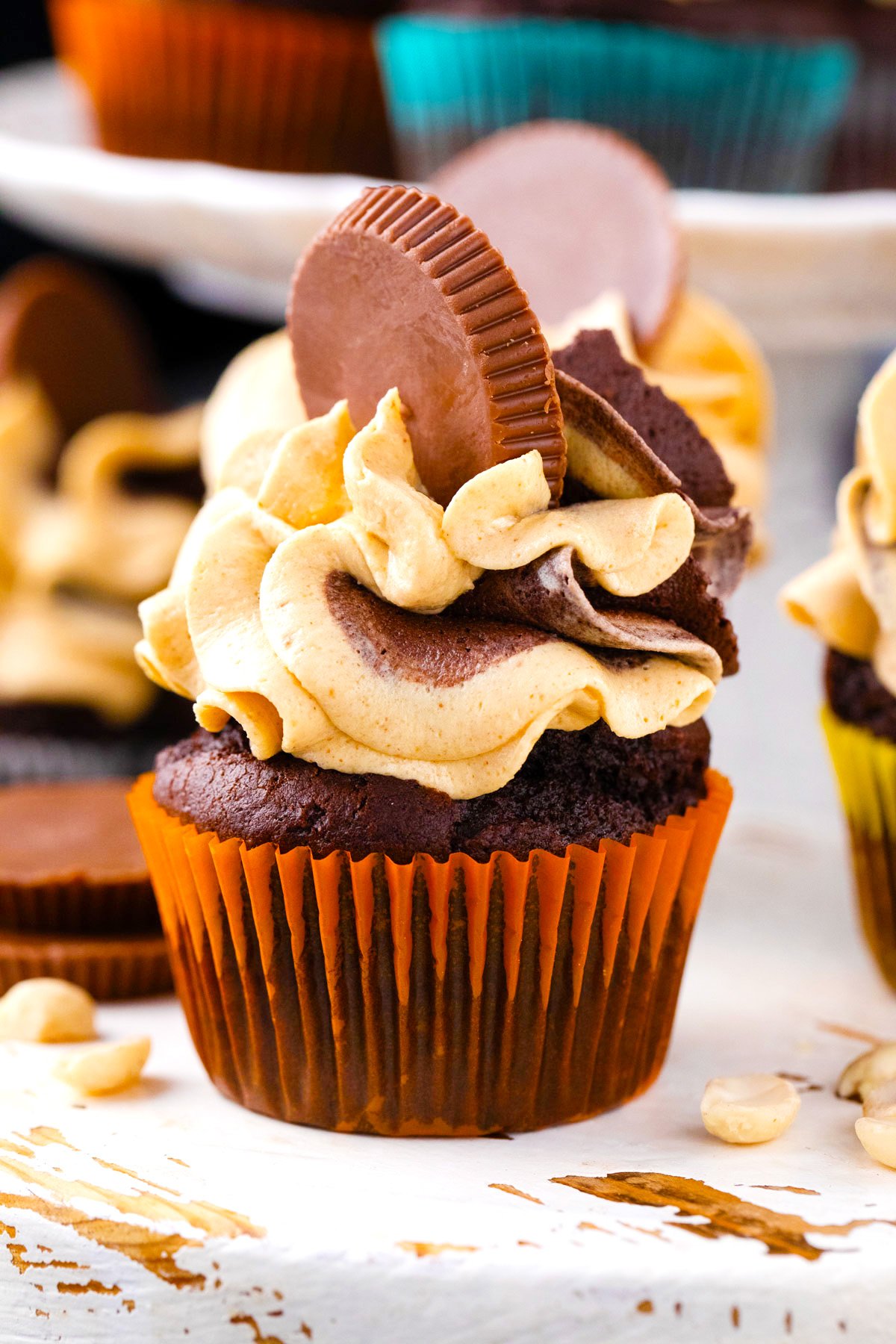 Homemade dark chocolate peanut butter cupcakes topped with peanut butter cups.