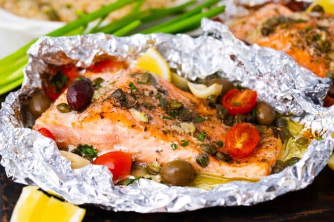 Mediterranean salmon foil packets with capers, tomatoes, olives, and lemon