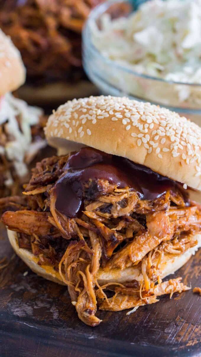 Image of pulled pork made in the instant pot with barbecue sauce on a bun.