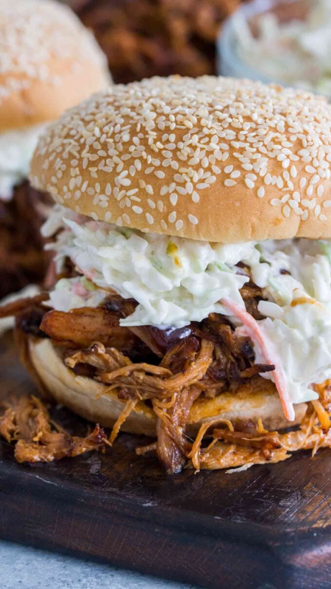 A close up picture of pressure cooker pulled pork on a bun.