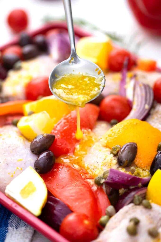 adding citrus marinade to chicken bake