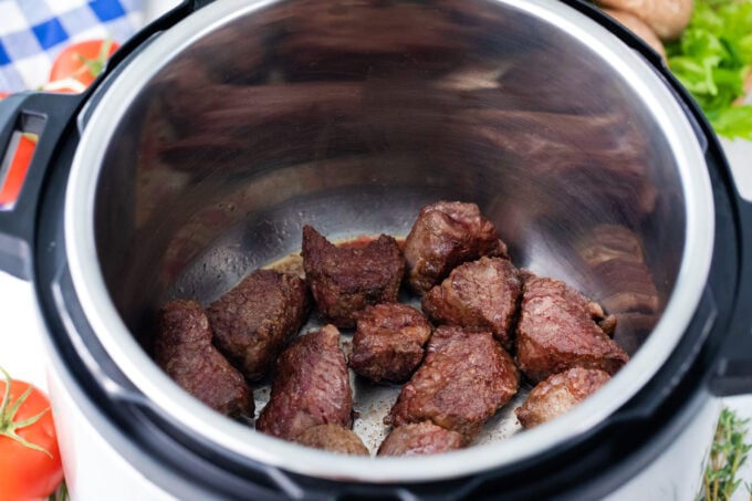Searing beef chunks in the Instant Pot.