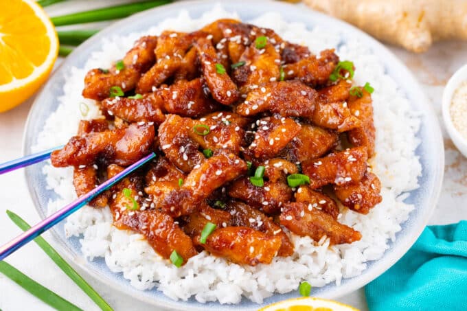 Crispy ginger sesame chicken over rice.