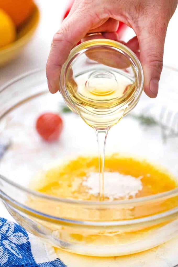 adding honey to citrus marinade