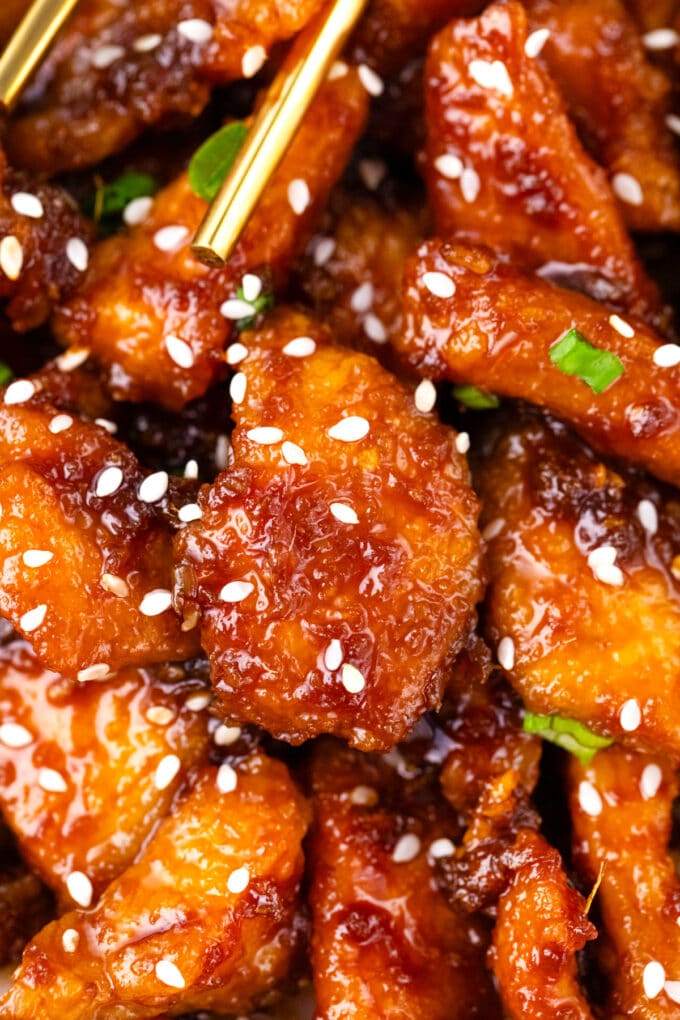 Close shot of crispy ginger sesame chicken pieces.