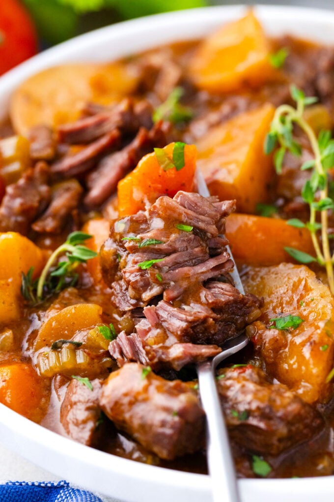 A forkful of very tender Instant Pot beef Bourguignon.