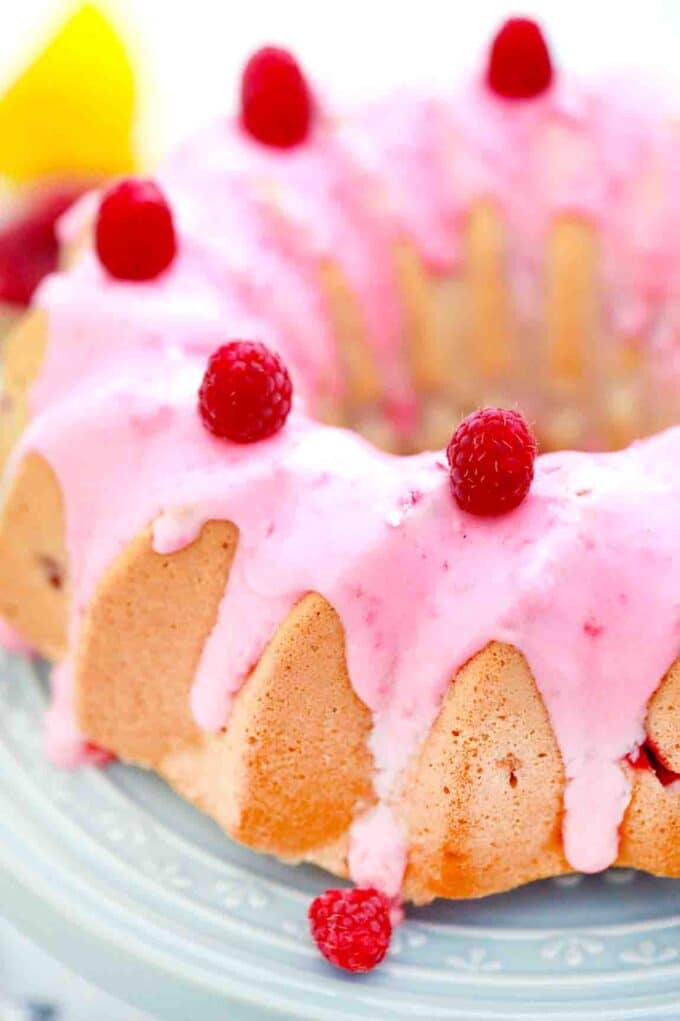 raspberry angel food cake on a cake stand