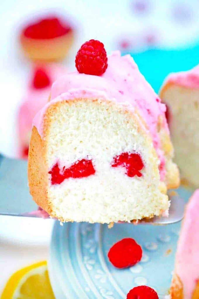a slice of raspberry angel food cake on a serving spatula