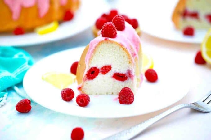 sliced raspberry angel food cake with raspberry glaze