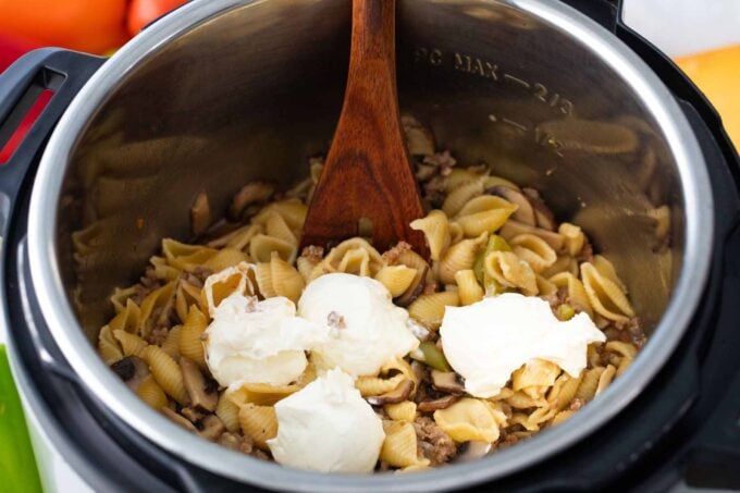 adding cream cheese and sour cream to instant pot philly cheesesteak pasta